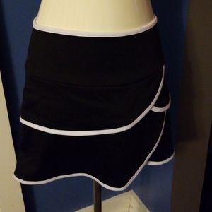 Juniors black skirt with white trim.
